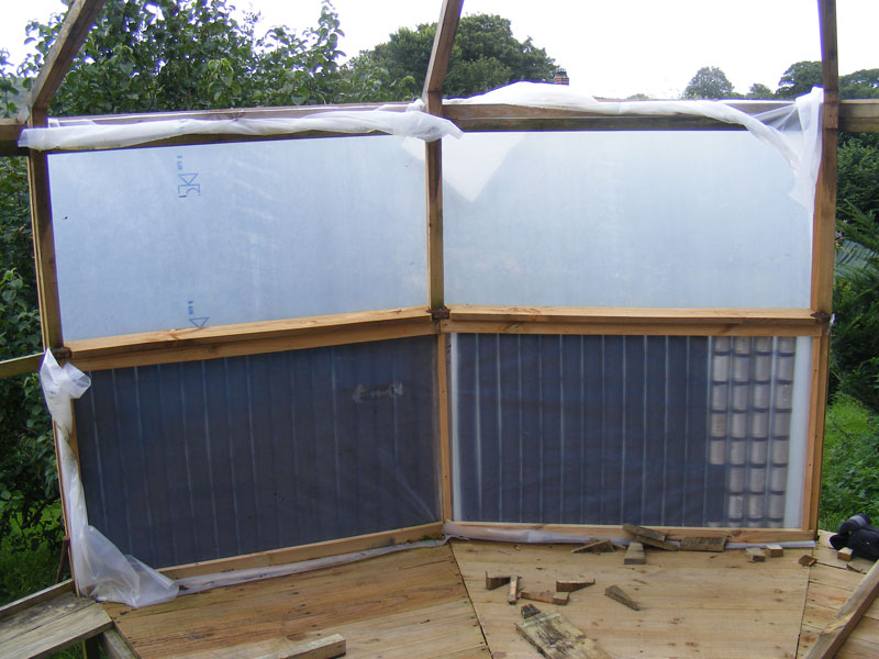 dogfood tin heating walls in the yurt